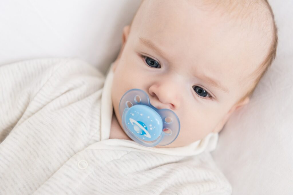 portrait of little baby with pacifier